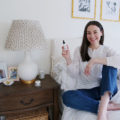 New Jersey blogger Carly Heitlinger holding a bottle of CBD oil