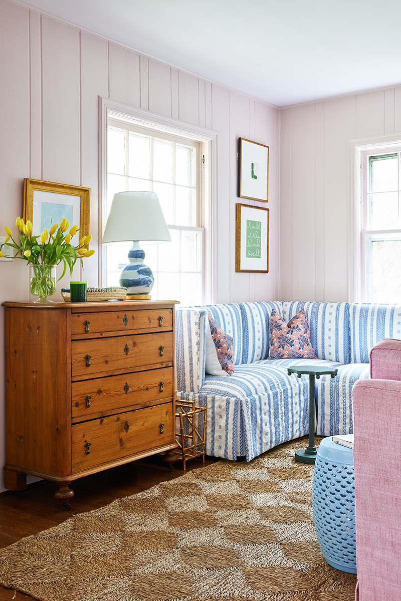 grandmillennial style living room for carly riordan by jennifer muirhead interiors featuring calamine by farrow and ball, henriette in terracotta pillows, kayce hughes art, and rush house original rug