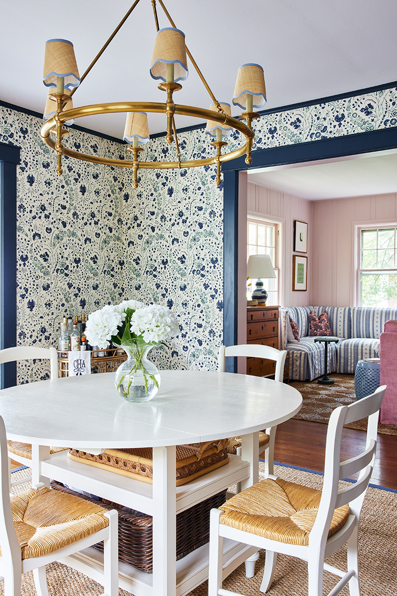 grandmillennial style dining room for carly riordan by jennifer muirhead interiors feauturing hague blue by farrow and ball, dianthus chintz soane wallpaper, serena & lily rosecliff chandelier, and pottery barn custom color-bound seagrass rug