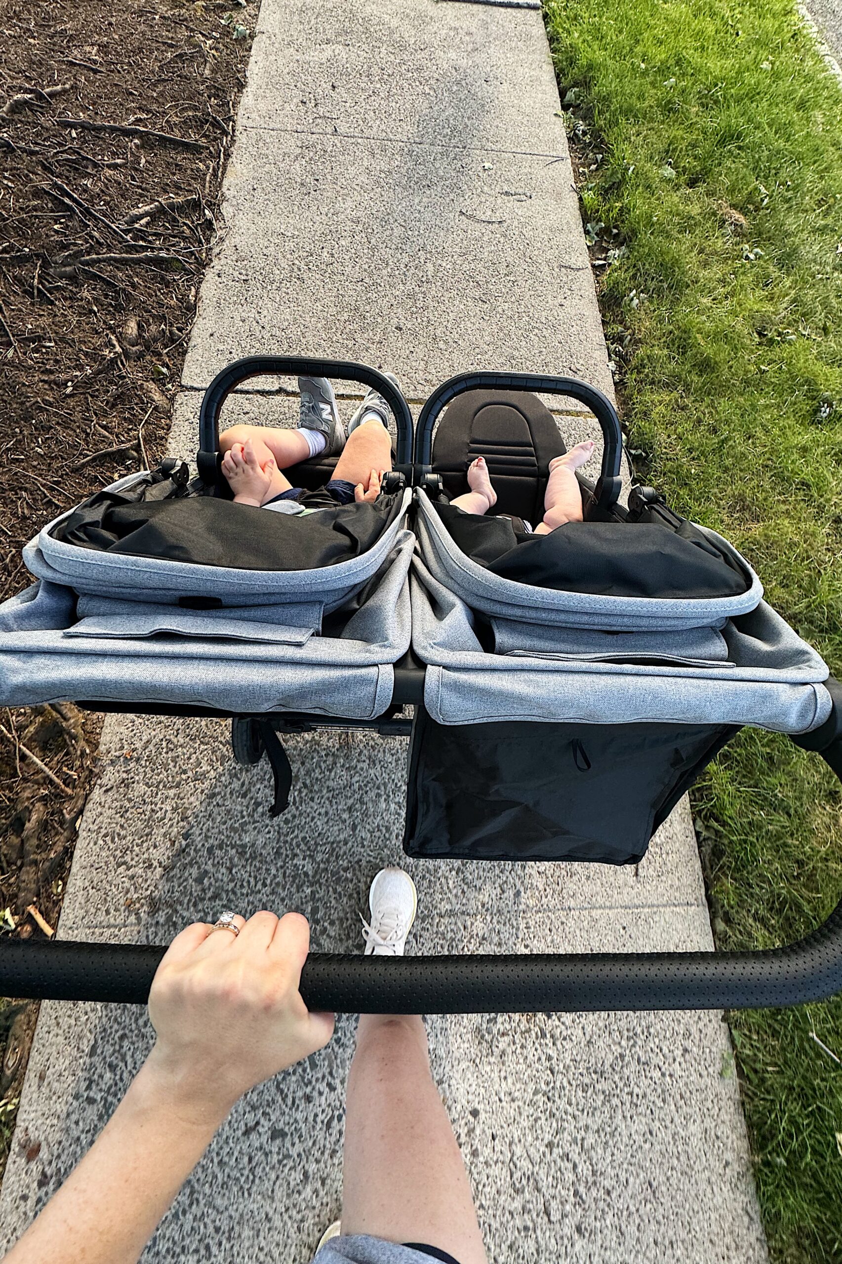 Carly pushing a double stroller with her two children in it