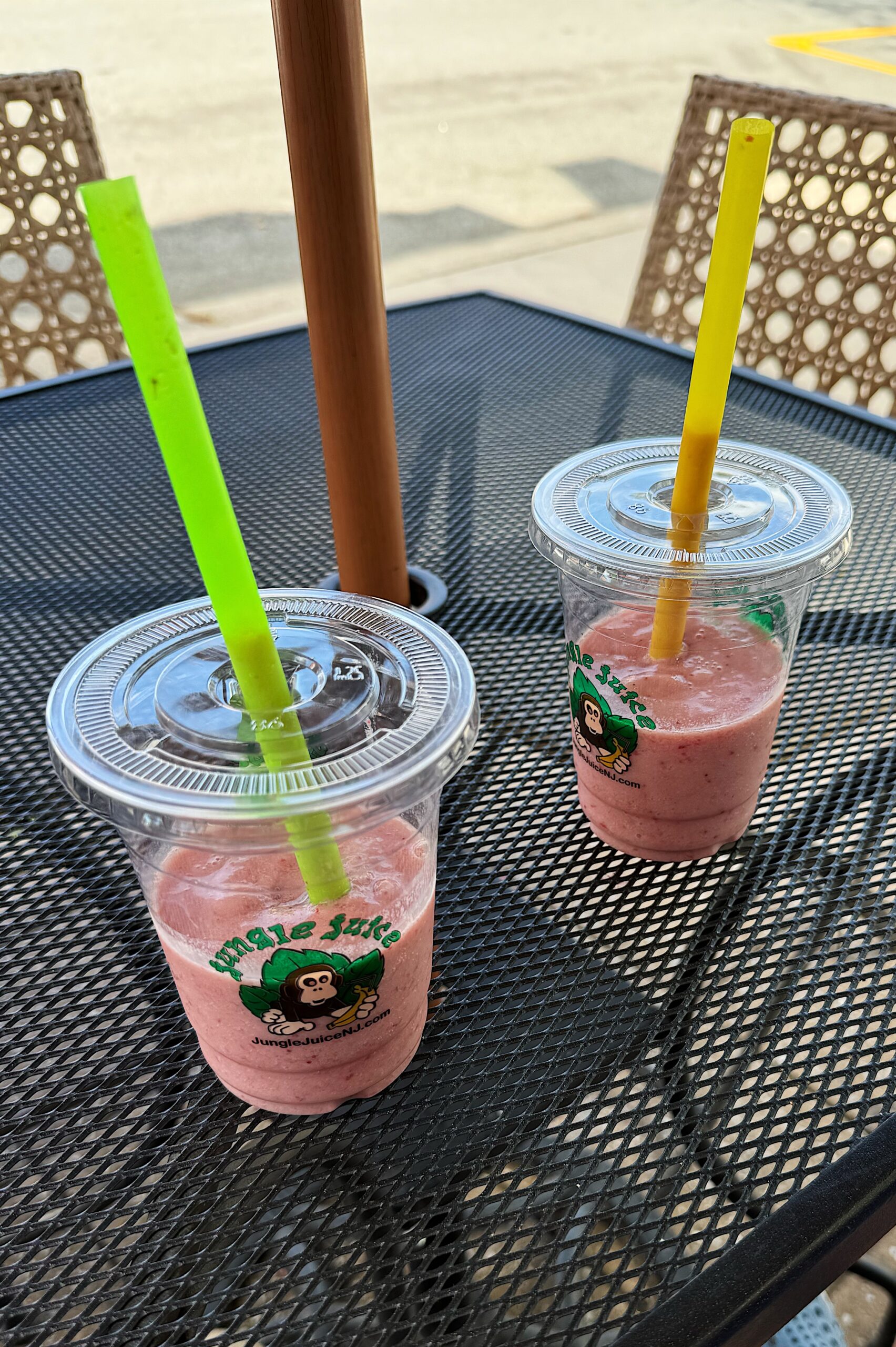 Two strawberry banana smoothies on a table