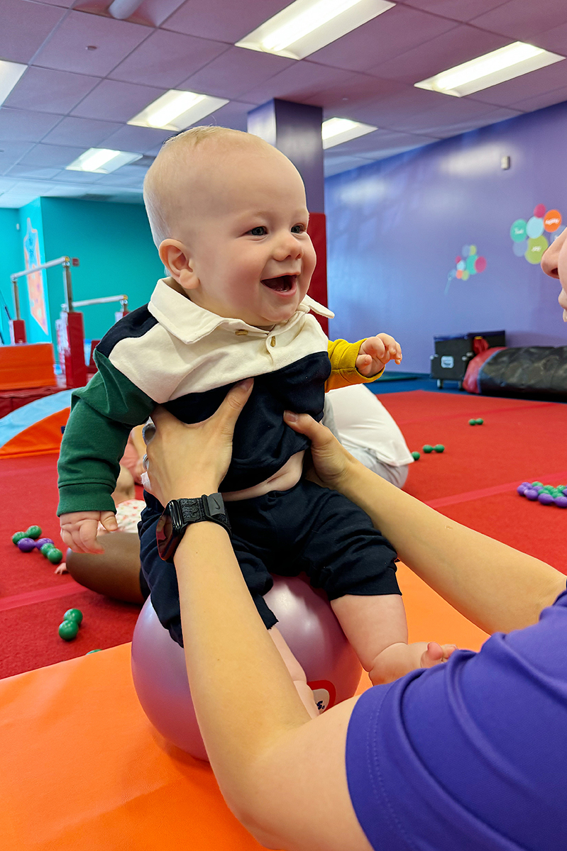 A baby on a bouncy ball